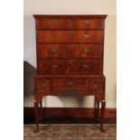 A GEORGE I WALNUT CHEST ON STAND