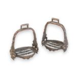 A PAIR OF BRONZE STIRRUPS