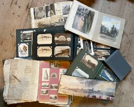 A COLLECTION OF POSTCARD ALBUMS AND SCRAP ALBUMS