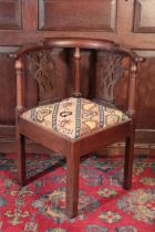 A GEORGE III MAHOGANY CORNER CHAIR