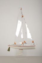 A RADIO CONTROLLED WHITE PAINTED WOOD RACING POND YACHT