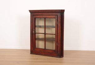 AN OAK HANGING CORNER CUPBOARD