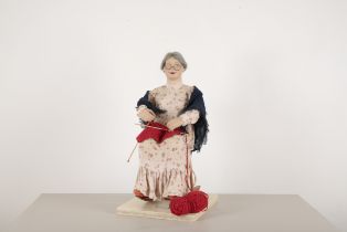 AN AUTOMATON OF AN ELDERLY WOMAN KNITTING