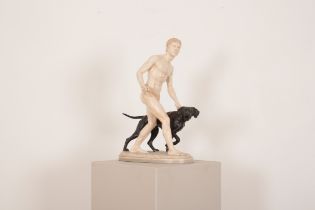 A DANISH ART DECO GLAZED POTTERY GROUP OF A FIGURE AND DOG