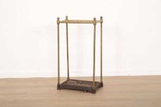 A LATE VICTORIAN BRASS AND CAST IRON STICK STAND