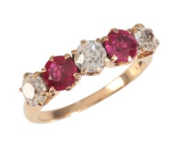 A RUBY AND DIAMOND FIVE STONE RING