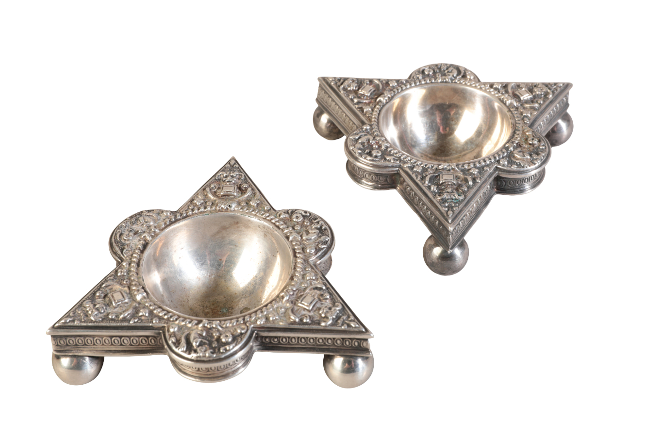 A PAIR OF WHITE METAL TRIANGULAR SALTS