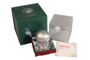 A COMMEMORATIVE SILVER SPHERE DECORATION FOR 35TH ANNIVERSARY OF THE ISSUANCE OF CHINESE PANDA