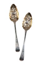 A PAIR OF GEORGE III EMBOSSED SILVER 'BERRY' SPOONS