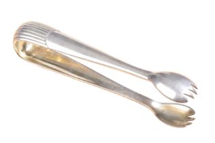 FABERGÉ: A PAIR OF EARLY 20TH CENTURY RUSSIAN SILVER SUGAR TONGS