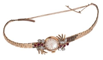 UNIVERSAL GENEVE: A LADY'S 9CT GOLD, DIAMOND, AND RUBY-SET COCKTAIL WATCH
