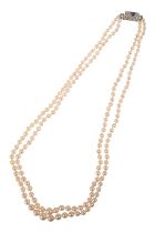 A VINTAGE SAPPHIRE AND DIAMOND TWO-ROW PEARL NECKLACE
