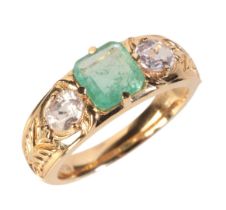 AN EMERALD AND SAPPHIRE THREE STONE RING