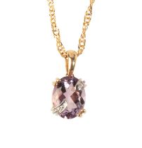 AN AMETHYST AND DIAMOND PENDANT NECKLACE