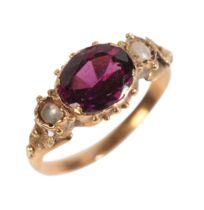 AN ANTIQUE VICTORIAN GARNET AND SEED PEARL RING