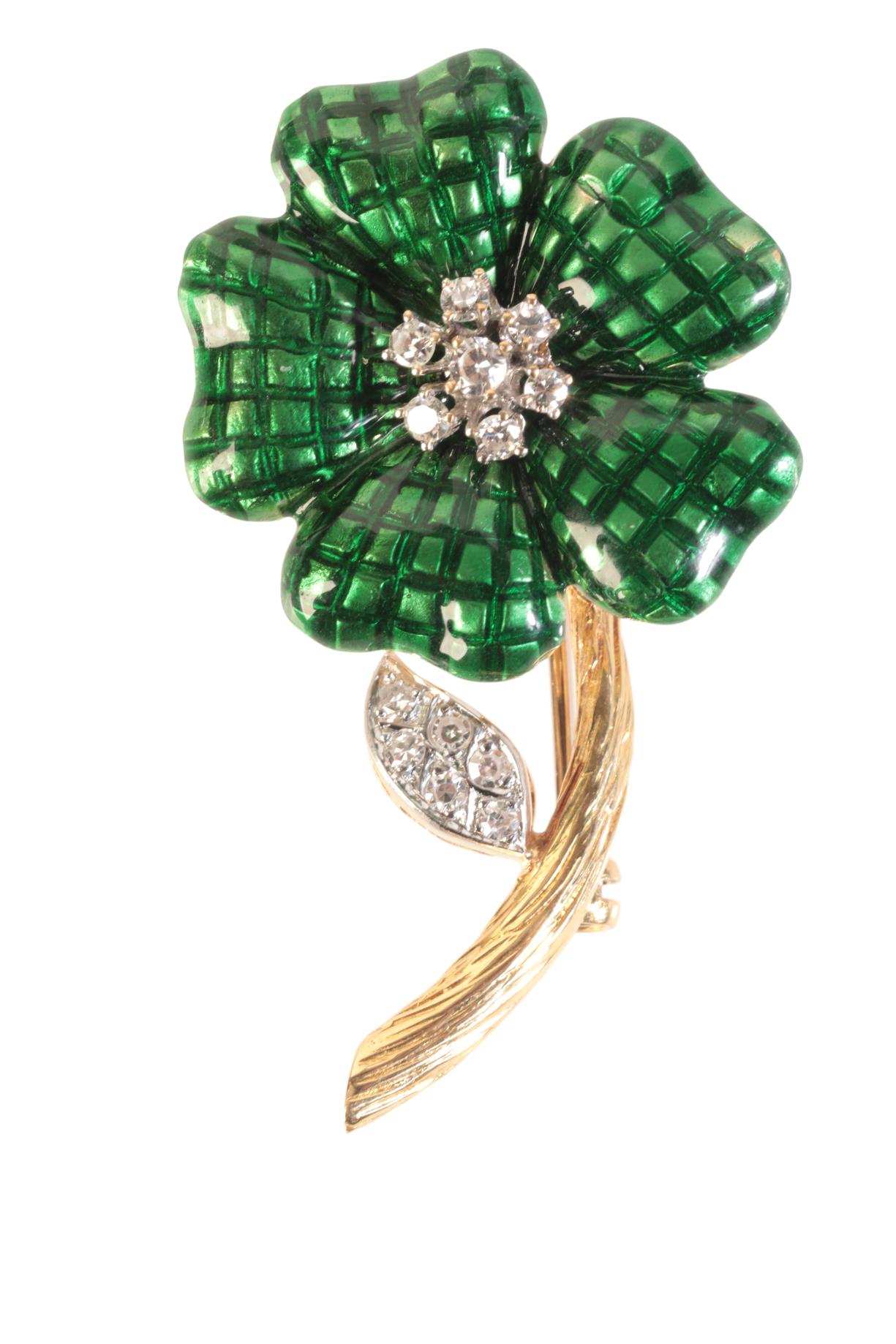 A VINTAGE ENAMEL AND DIAMOND FLOWER BROOCH