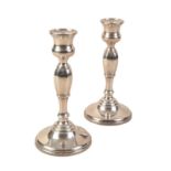 A PAIR OF ELIZABETH II SILVER CANDLESTICKS