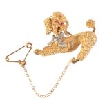 A VINTAGE RUBY AND DIAMOND POODLE BROOCH