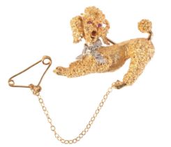 A VINTAGE RUBY AND DIAMOND POODLE BROOCH