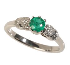 AN EMERALD AND DIAMOND RING