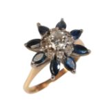 A SAPPHIRE AND DIAMOND CLUSTER RING