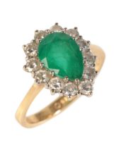 A 2.20 CARAT PEAR CUT EMERALD AND DIAMOND CLUSTER RING