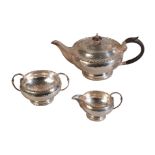 AN EARLY 20TH CENTURY SILVER PLATED THREE PIECE TEA SERVICE