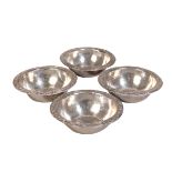 A SET OF FOUR PERUVIAN WHITE METAL BOWLS