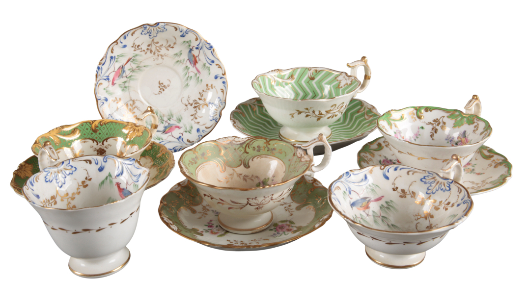 A GROUP OF FIVE H & R DANIEL FIRST BELL SHAPE CUPS AND SAUCERS