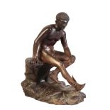 A PATINATED BRONZE FIGURE OF MERCURY SEATED ON A ROCK