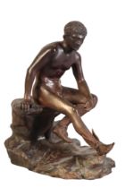 A PATINATED BRONZE FIGURE OF MERCURY SEATED ON A ROCK