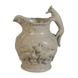 A MINTON PALE GREEN POTTERY 'FOXES AND HOUNDS JUG'