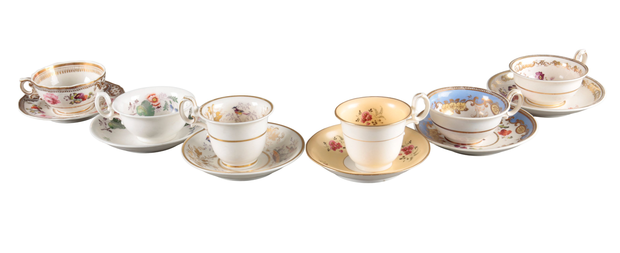 A GROUP OF FIVE H & R DANIEL SECOND GADROON-SHAPE CUPS AND SAUCERS