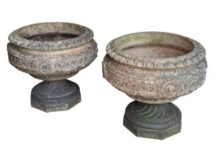 A PAIR OF RECONSTITUTED STONE GARDEN URNS