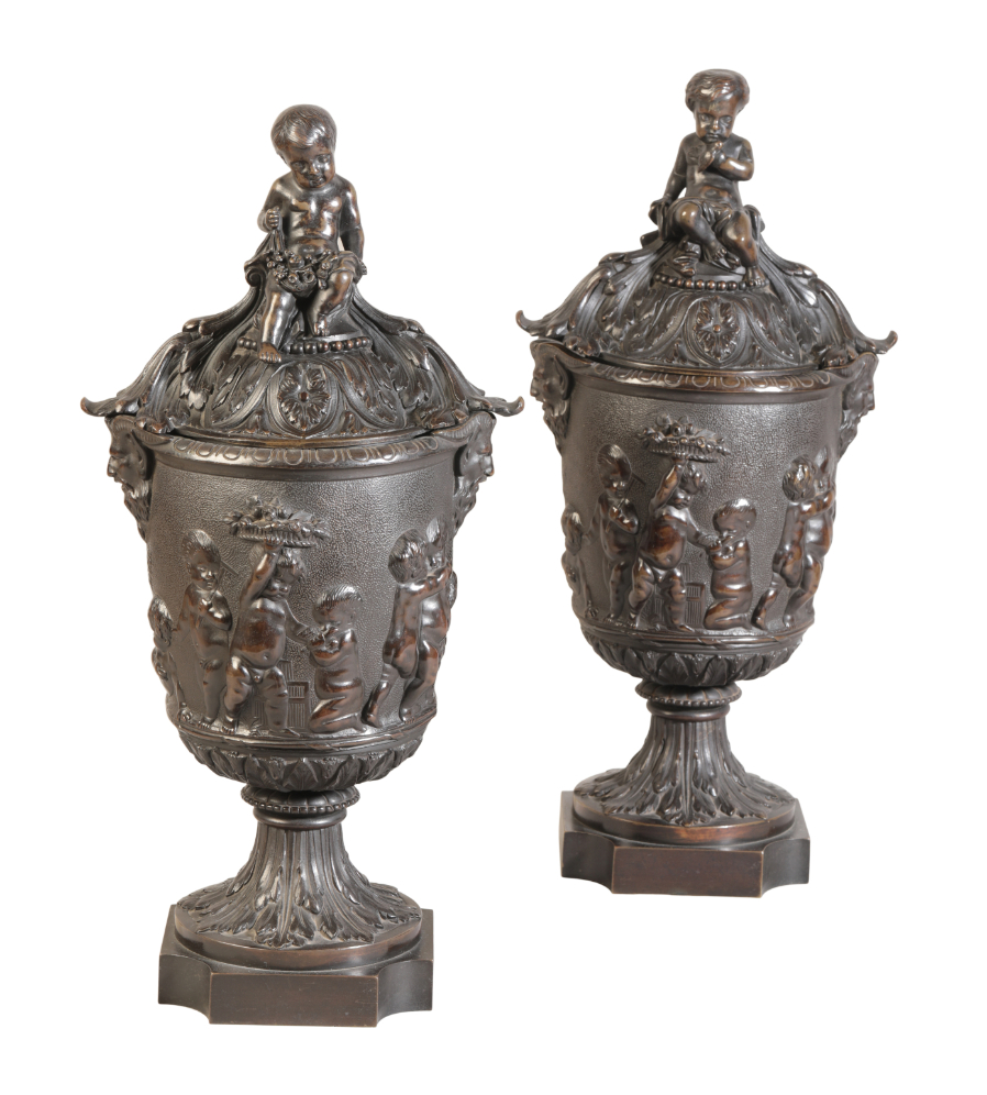 A MATCHED PAIR OF LARGE PATINATED BRONZE URNS WITH COVERS