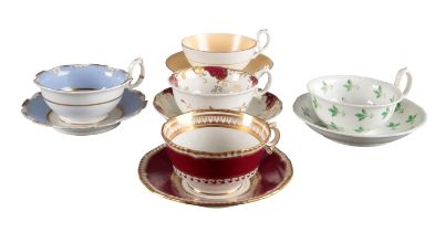 A GROUP OF FIVE H & R DANIEL LARGE TEACUPS AND SAUCERS OF VARIOUS SHAPES