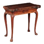 A GEORGE II FIGURED WALNUT CARD TABLE