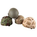 FOUR COMBAT HELMETS OF THE BRITISH ARMED FORCES