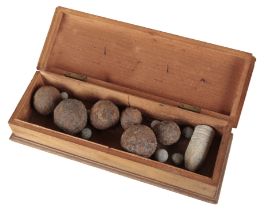 A COLLECTION OF VARIOUS CANNON BALLS AND LEAD SHOT