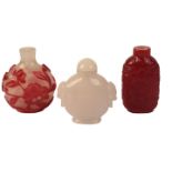 A GROUP OF THREE CHINESE GLASS SNUFF BOTTLES