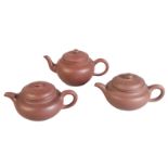 A GROUP OF THREE CHINESE YIXING TEAPOTS