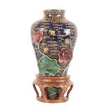 A CHINESE FAMILLE ROSE WALL VASE