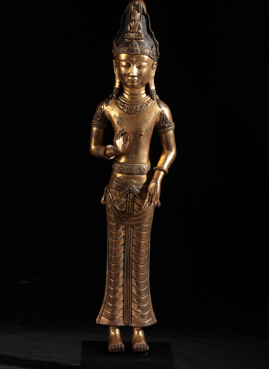 A SINO-TIBETAN GILT BRONZE DEITY