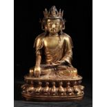 A CHINESE GILT-BRONZE BUDDHA