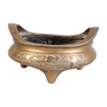 A CHINESE BRONZE TRIPOD CENSER