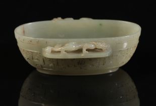 A CHINESE CELADON JADE OVAL BOWL