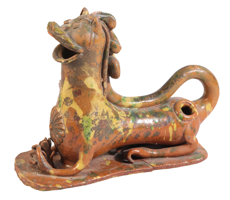 A CANNAKALE POTTERY RECUMBENT LION EWER