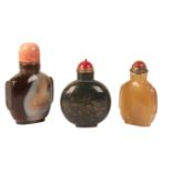 A GROUP OF THREE CHINESE AGATE SNUFF BOTTLES