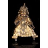 A TIBETAN GILT BRONZE FIGURE OF MAHAKALA