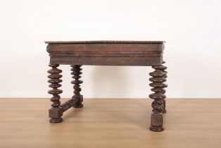 A CONTINENTAL BLACK WALNUT TABLE